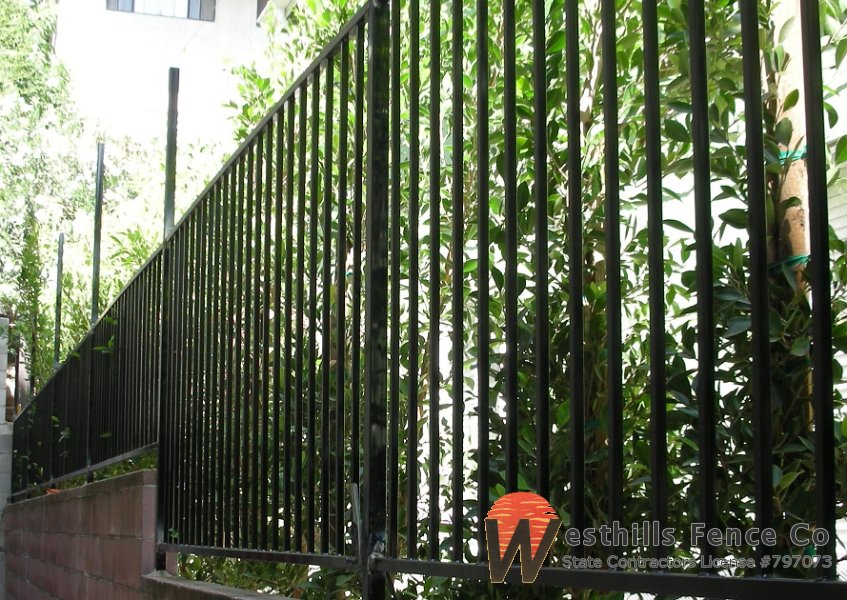 Regal iron fence on the top of the wall
