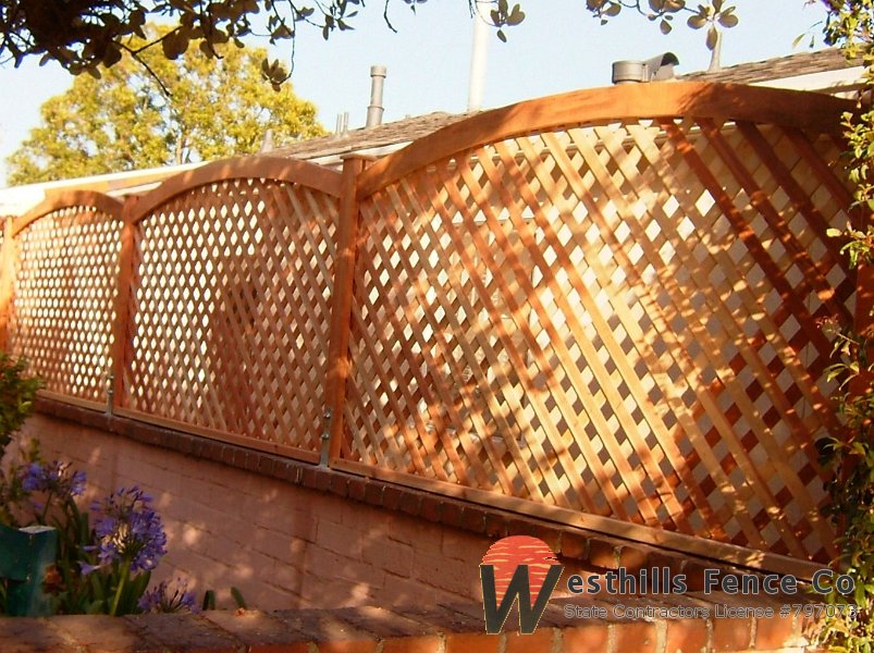 Arch redwood lattice on the top of the wall