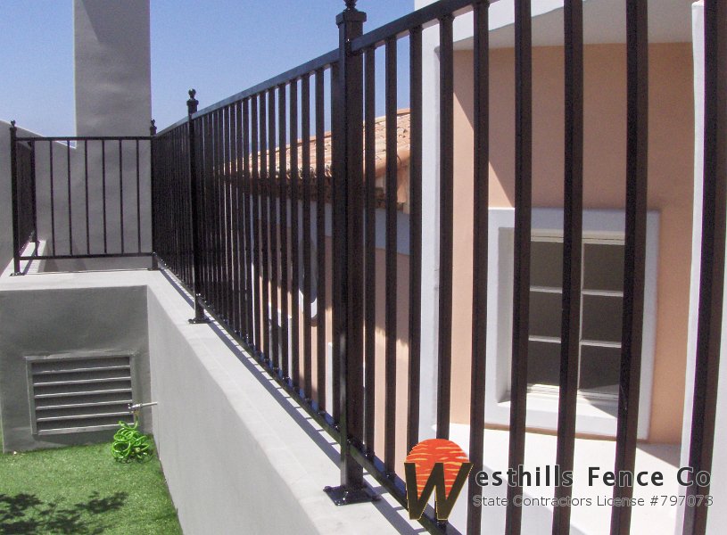 Regal iron fence top of the wall